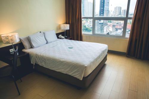 Cama o camas de una habitación en Go Hotels Plus Mandaluyong