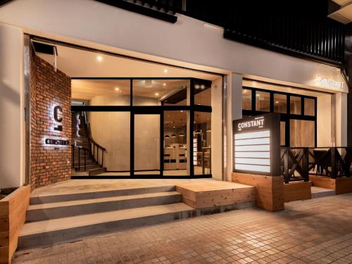 a store front with a set of stairs in front at CABIN&HOTEL CONSTANT NAHA in Naha
