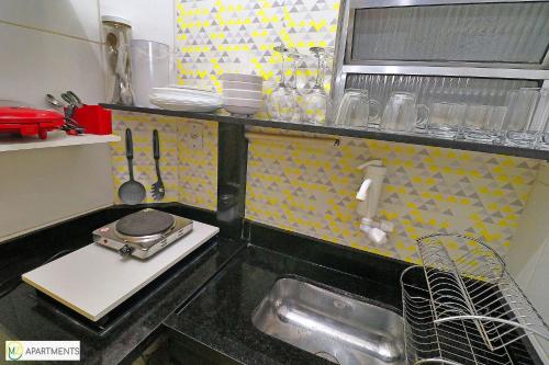 Dapur atau dapur kecil di Studio estiloso e com otima localização