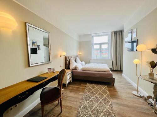 Postel nebo postele na pokoji v ubytování Lexow - Hotel an de Havenkant