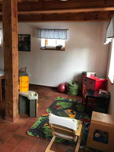 a living room with a rug on the floor at Samota u Hadince in Bartošovice v Orlických Horách