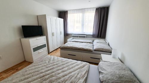 Tempat tidur dalam kamar di Apartmán Love Bojnice