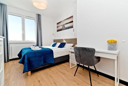 Postel nebo postele na pokoji v ubytování BlueApart Apartamenty Hotelowe Nexo