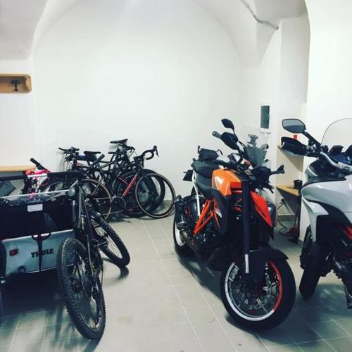 a group of motorcycles parked in a room at DolceVita Ambiez B&B in San Lorenzo in Banale