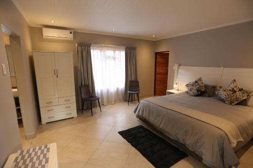 Katil atau katil-katil dalam bilik di Rhino Coast Guesthouse