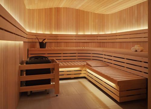 a wooden sauna with a bench in it at Alila Marea Beach Resort Encinitas, a Hyatt Resort in Encinitas
