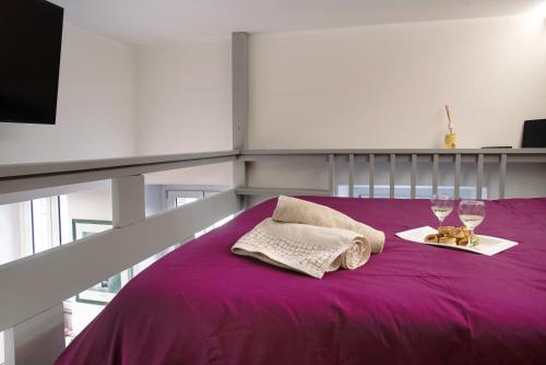 Säng eller sängar i ett rum på Efihouse Lago Maggiore