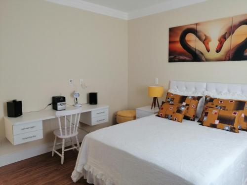 Postel nebo postele na pokoji v ubytování Apartamento Aconchegante de luxo da Elena