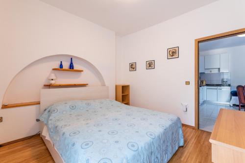 Postel nebo postele na pokoji v ubytování Apartments Zdena