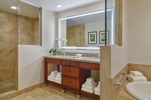 a bathroom with a sink and a mirror at Sheraton Vistana Villages Resort Villas, I-Drive Orlando in Orlando