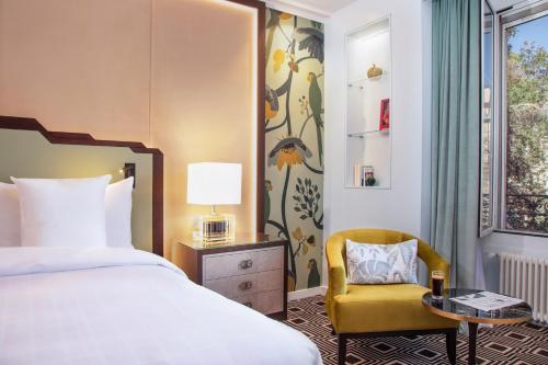 Postel nebo postele na pokoji v ubytování Hotel Bristol