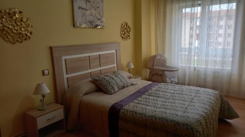 A bed or beds in a room at Lunair Ciudad de Medina