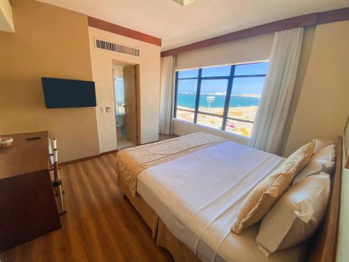 Postel nebo postele na pokoji v ubytování Magna Praia Hotel