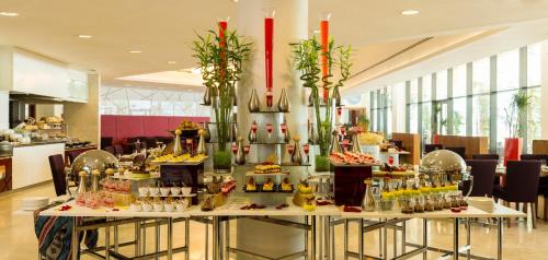 a buffet of food on a table in a restaurant at Radisson Blu Hotel, Abu Dhabi Yas Island in Abu Dhabi