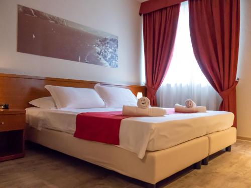 Ένα ή περισσότερα κρεβάτια σε δωμάτιο στο Hotel Venezia Park - ENJOY HOLIDAY