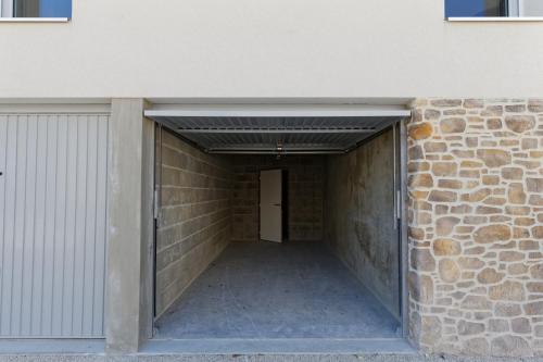a hallway leading into a building with a garage at Face à la mer - 50 m de la plage des homardiers in La Guérinière