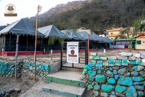 a building being constructed with blue and green at Riverside Swiss Camps "Adventure Bear Buddies" in Rishīkesh