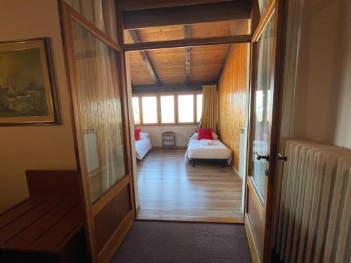 Postel nebo postele na pokoji v ubytování Hotel New Genziana