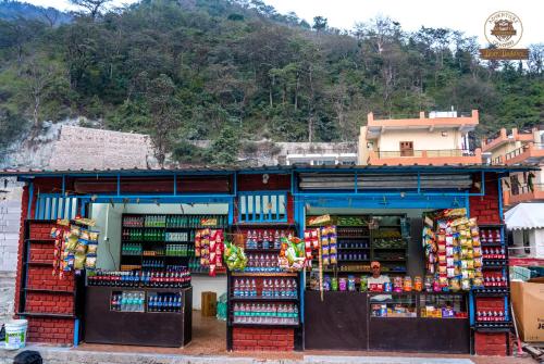 a store with a bunch of books on display at Riverside Swiss Camps "Adventure Bear Buddies" in Rishīkesh