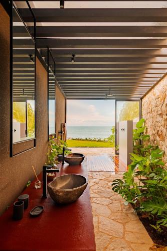 a bathroom with two sinks in a room with a view at Carmel Taíba Exclusive Resort in Taíba