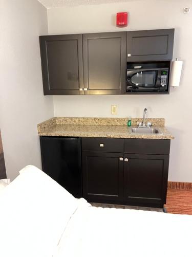a kitchen with a sink and a microwave at Landmark Resort in Myrtle Beach