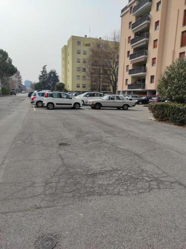 a parking lot with cars parked in a parking lot at Appartamento Padova zona strategica in Padova