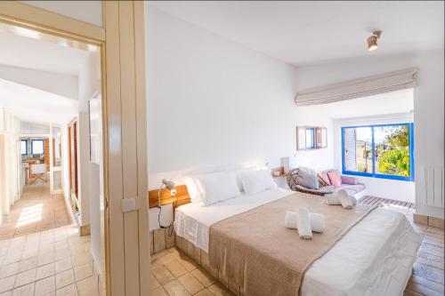 En eller flere senge i et værelse på Casa do Barco