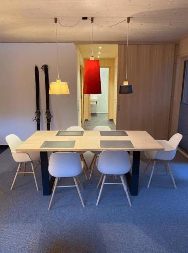 a conference room with a table and chairs at Villa Smilla in Gaschurn