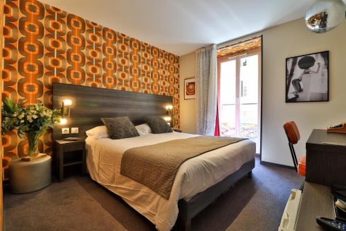 Cama o camas de una habitación en Hôtel Le G (ex Le Genève)
