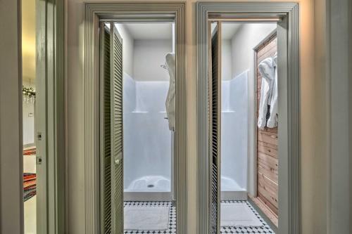 a bathroom with a walk in shower next to a tub at Chalet at Falling Water Close to Bike Trails in Bella Vista