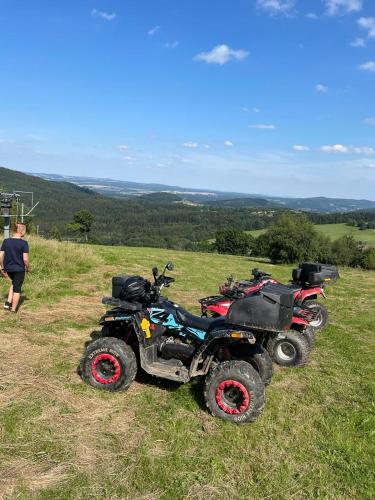a group of four atvs parked on a hill at Restauracja i Noclegi Izba Rybacka w Krainie Wygasłych Wulkanów in Podgórki
