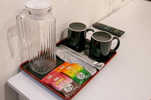Kavos ir arbatos ruošimo rinkinys apgyvendinimo įstaigoje Grand Swiss Hotel
