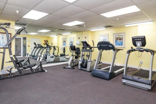 a gym with several tread machines in a room at Navarre Beach Regency 308 in Navarre