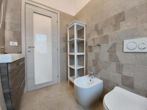 a bathroom with a sink and a toilet and a shower at Bergamo Allegra in Bergamo