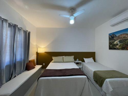 Säng eller sängar i ett rum på Pousada Reserva de Itaúna