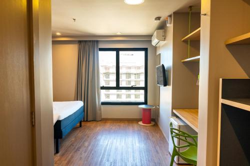 Voodi või voodid majutusasutuse ibis Styles Porto Alegre Moinhos de Vento toas