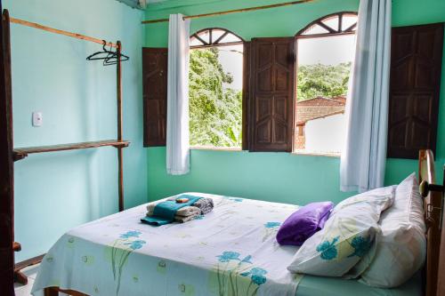Postel nebo postele na pokoji v ubytování Casa da Mineira Hospedaria