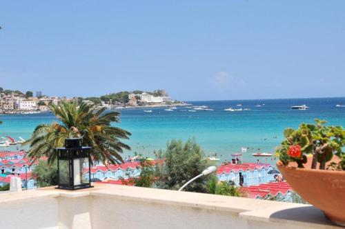 a view of the beach from the balcony of a resort at Villa Olimpia in Mondello