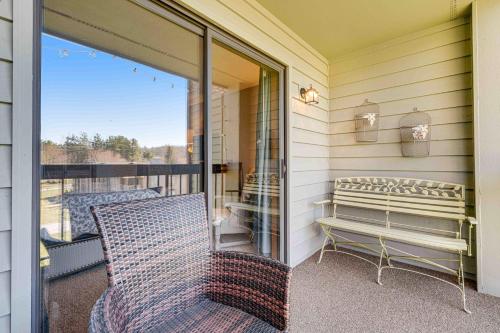 a porch with a bench on a balcony at Chetola Cardinal 201 in Blowing Rock
