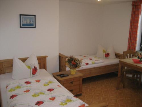 Ένα ή περισσότερα κρεβάτια σε δωμάτιο στο Hotel Brückenmühle