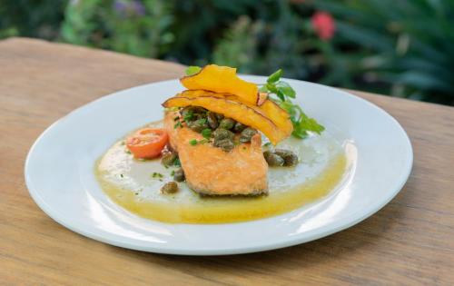 a white plate with a piece of food on a table at Hotel La Calma De Rita - Pirque in Pirque