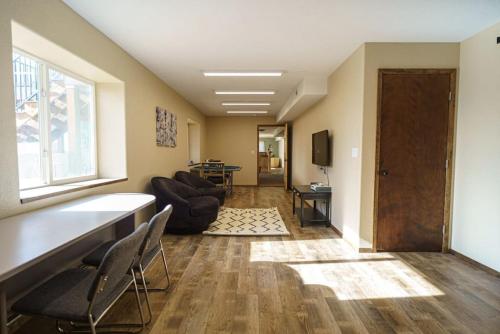 a living room with a couch and chairs and a window at 24 Quiver Circle Spectacular Mountain View 5 Acres PIKES PEAK in Florissant