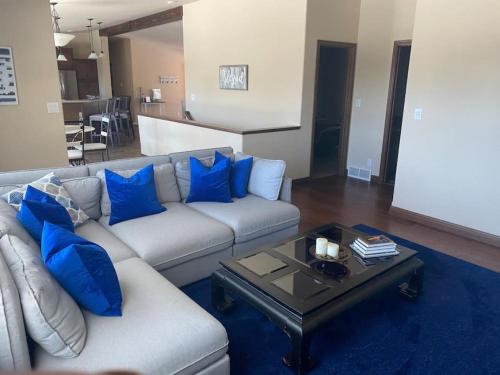 a living room with a couch and a coffee table at 24 Quiver Circle Spectacular Mountain View 5 Acres PIKES PEAK in Florissant