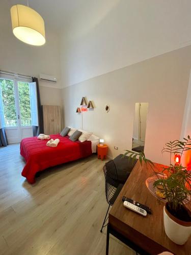 Posteľ alebo postele v izbe v ubytovaní 4 Balconi rooms Paladini B&B e appartamenti