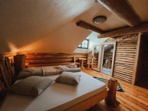 a room with two beds in a log cabin at Bordeiul Legionarilor in Vatra Dornei