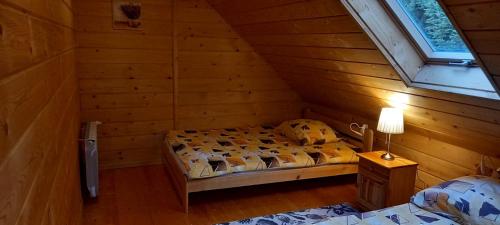 Posteľ alebo postele v izbe v ubytovaní Walówka