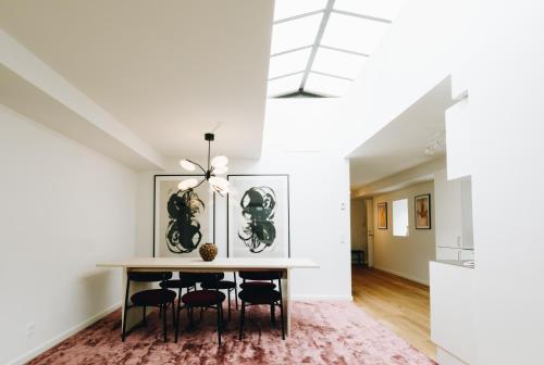a dining room with a table and chairs at Beautiful Apartments on Strøget in Copenhagen City Center in Copenhagen