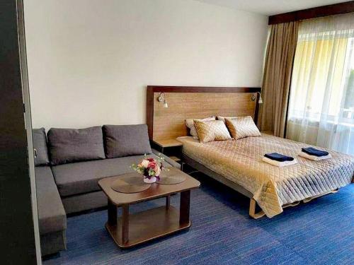 Postel nebo postele na pokoji v ubytování Amber Studio