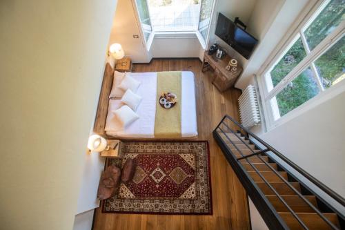 an overhead view of a room with a bed and a table at Torre Scribanti in Sestri Levante