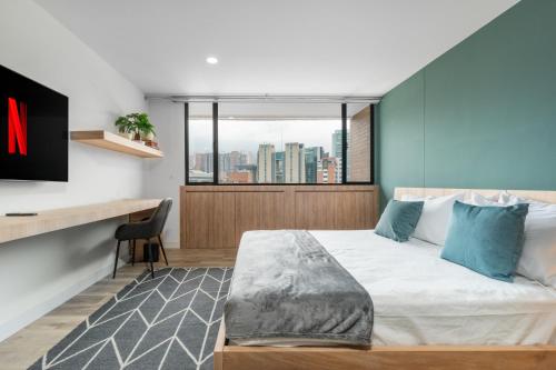 Ein Bett oder Betten in einem Zimmer der Unterkunft Apartamentos Go Living & Suites by HOUSY HOST